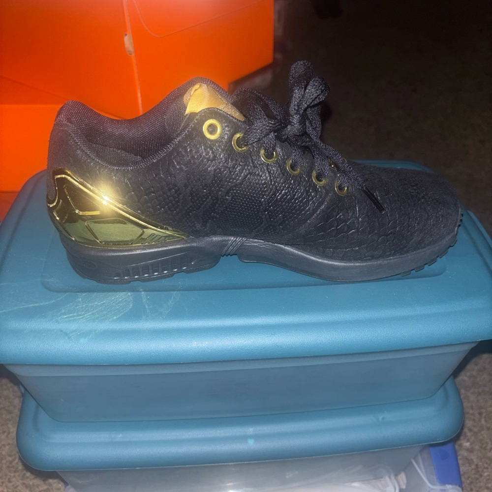 Black and Gold Adidas Torsion